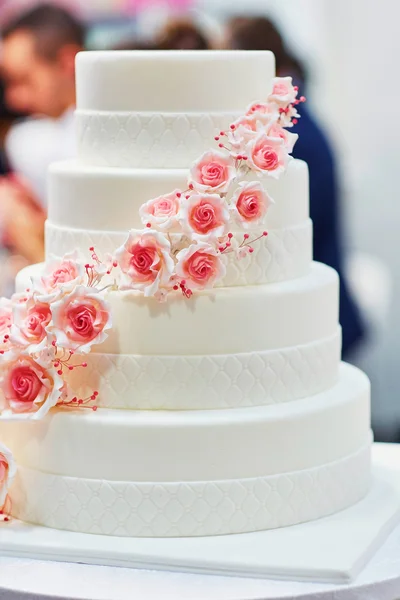 White wedding cake decorated with flowers