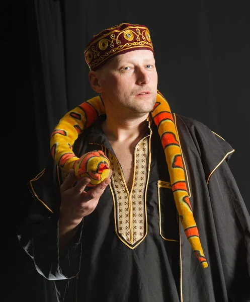 Actor with toy snake.