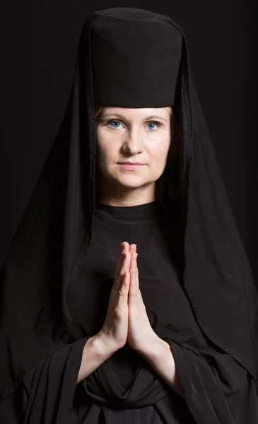 Woman in a monk robe.