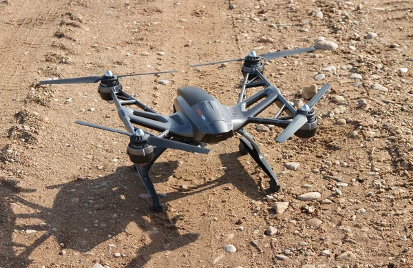 Drone on a gravel road surface.