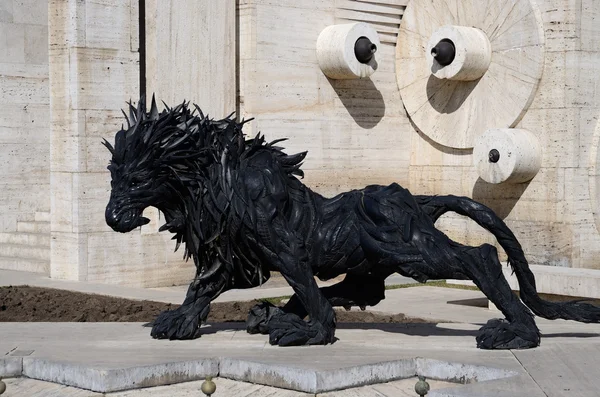 EREVAN, ARMENIA - March 8, 2015: Lion art satue made from old car tyres near Yerevan Cascade, giant stairway in Erevan, Armenia