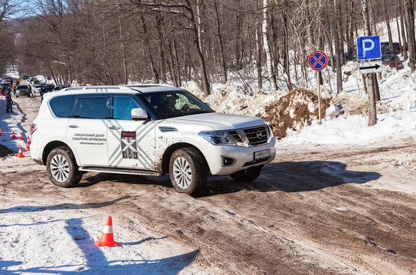 Vehicle Nissan Patrol moving  in sunny day on the rural road