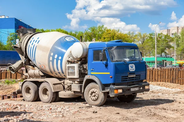 Concrete mixer truck KAMAZ at the construction of road