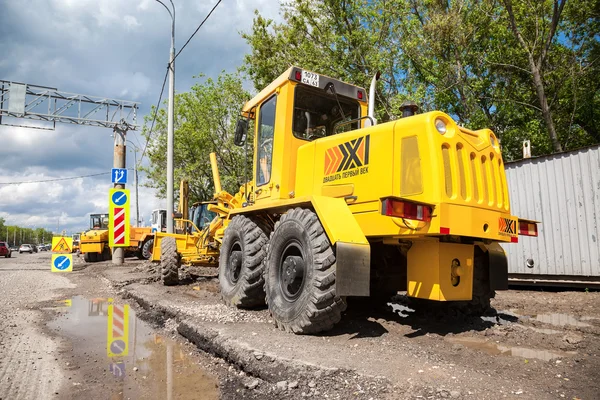 Heavy construction machinery parked near the under construction