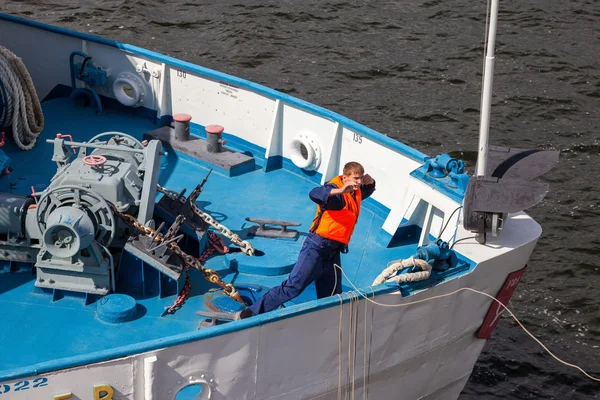 SAMARA, RUSSIA - AUGUST 31, 2014: Sailor throws a rope for moori