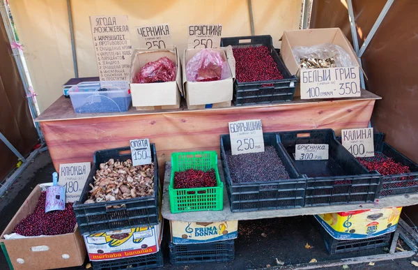 Fresh organic mushrooms and berries for sale at the farmers mark