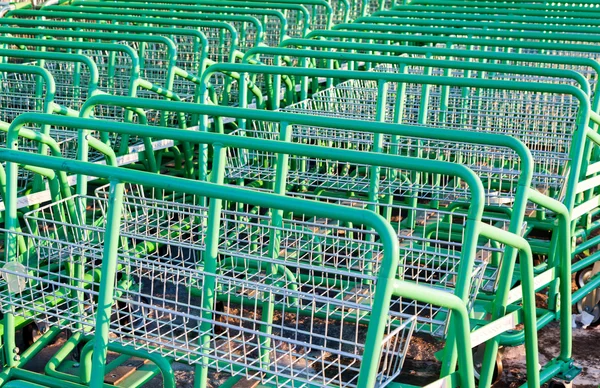 Large empty green shopping cart Leroy Merlin store