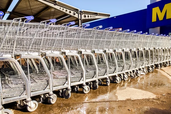 Large empty blue shopping cart Metro store