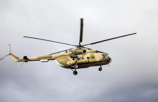 Russian army Mi-8 helicopter in action against cloudy sky