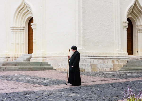 Monk and the Church of the Descent of the Holy Spirit. Holy Trinity St. Sergius Lavra. Sergiev Posad