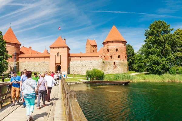 Tourists and Trakai Castle. Lithuania