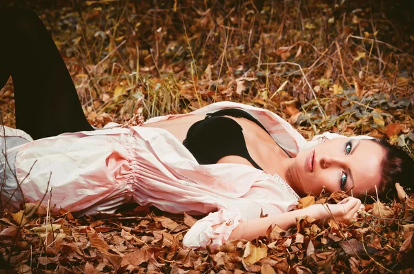 Woman lying on the leaves