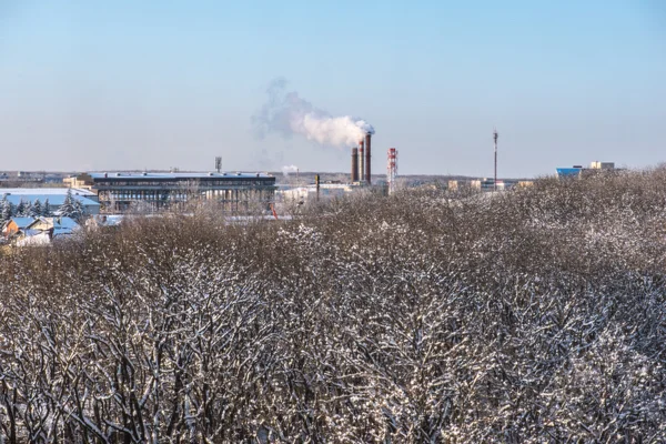 Chemical factory in the evening, with pipes and smoke