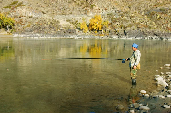 Fisherman on river