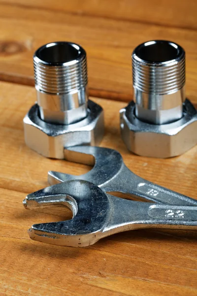 Wrenches with bolts on a desktop Close-up