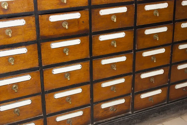 Antique wooden storage boxes in a Archive