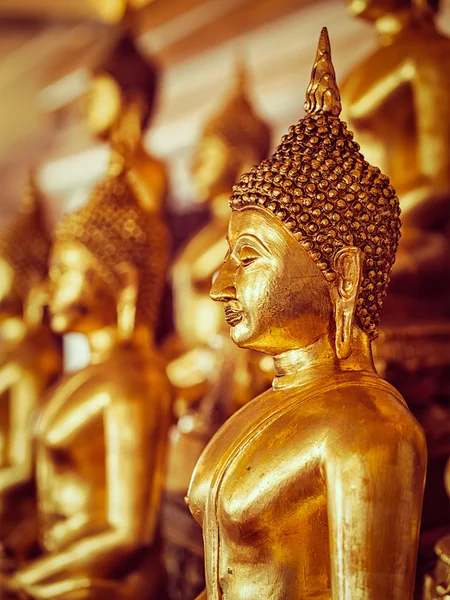 Golden Buddha statues in buddhist temple