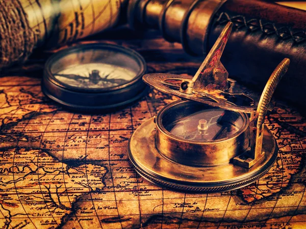 Old vintage compass on ancient map