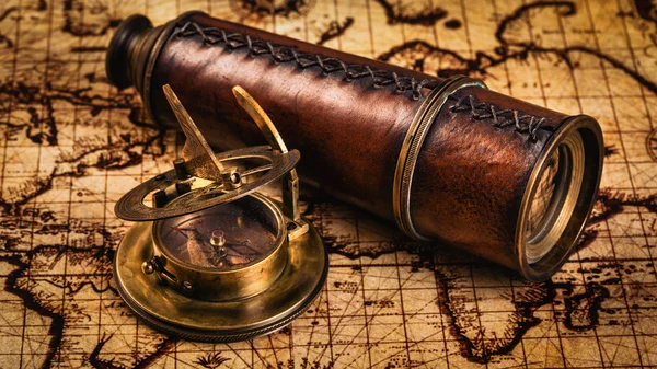 Old vintage compass on ancient map