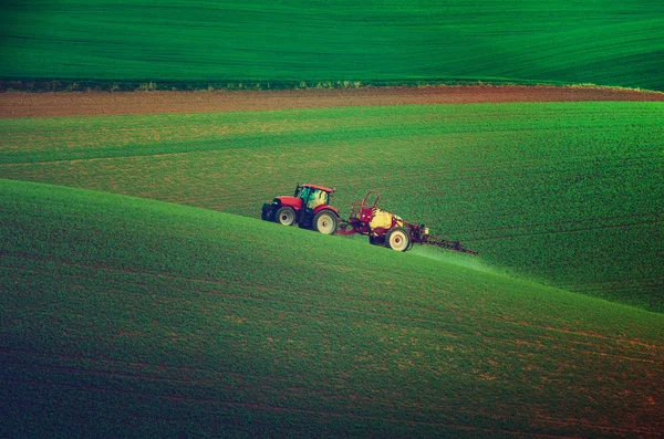 Farm machinery spraying insecticide