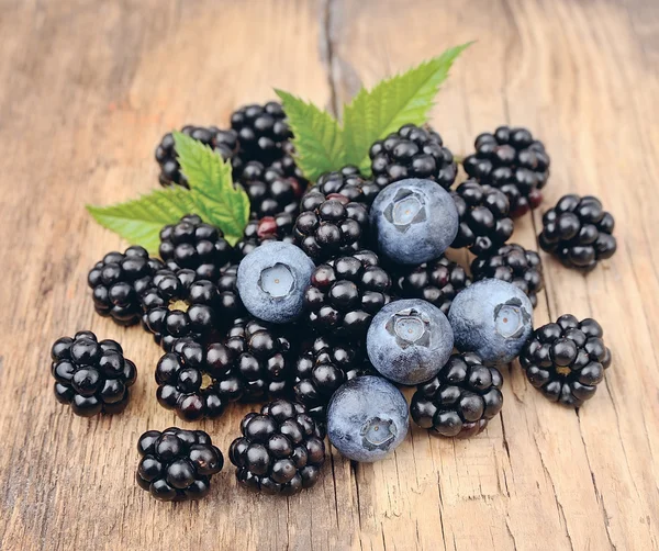 Sweet berries of blackberry and blueberries.  Mix berries.