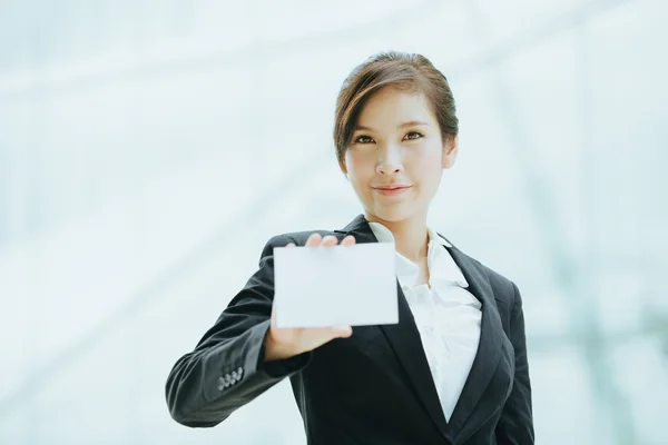 Businesswoman with blank card