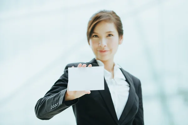 Businesswoman with blank card