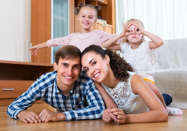 Relaxed family of four posing