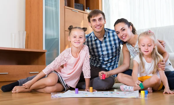 Family  playing at board game