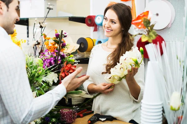 Woman seller in flower shop