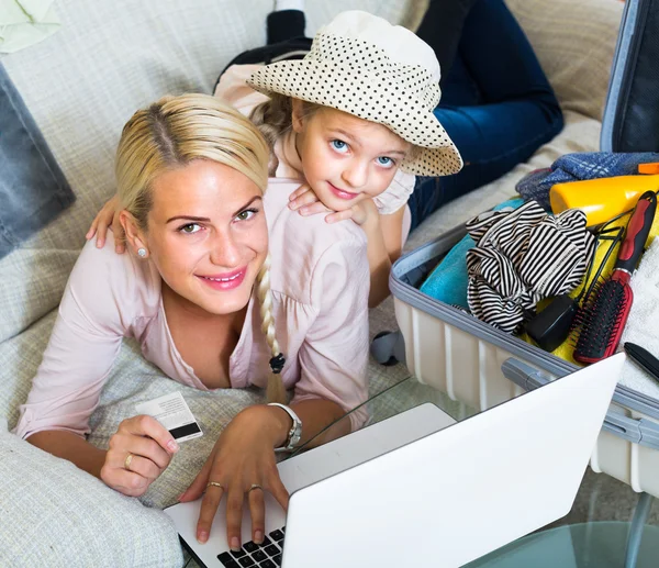 Family of two buying tickets online