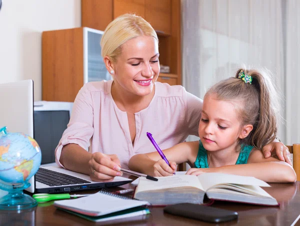 Teacher and  girl studying at home