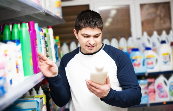 Male customer buying shampoo
