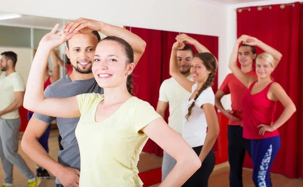 People dancing salsa in studio