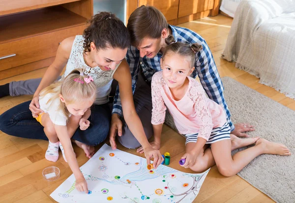 Family  playing at board game