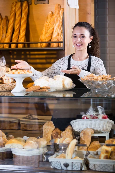 Young woman at bakery display