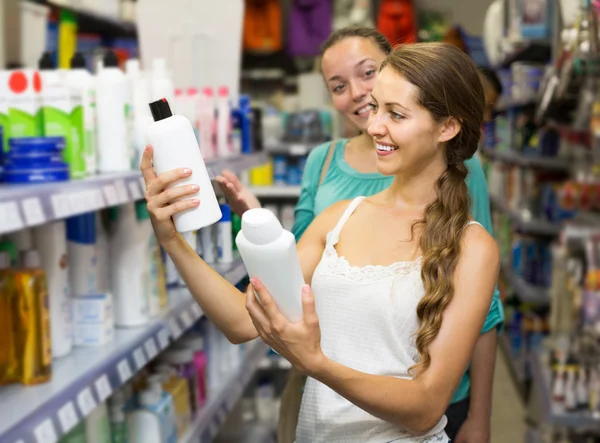 Girl buying shampoo