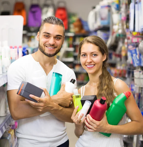 Couple with shampoo in the store