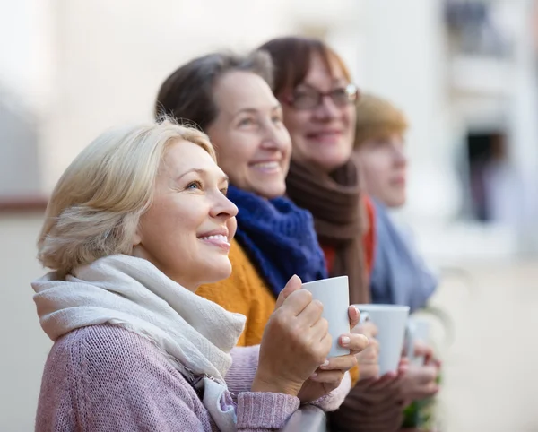 Senior women drinking tea at balcony