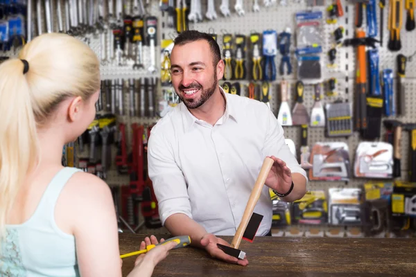 Customer getting help at pay desk