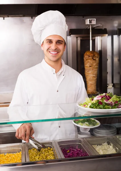 Chef with kebab at fastfood