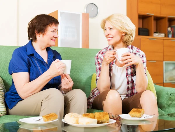 Women colleagues drinking coffe