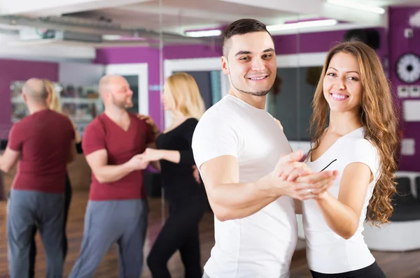 Couples enjoying of partner dance