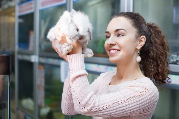 Woman holding fluffy animal
