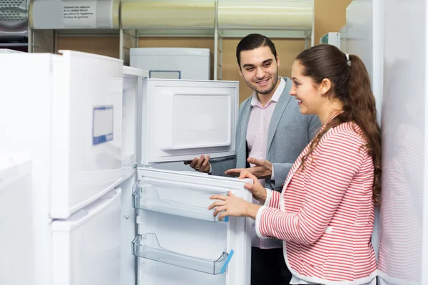 Couple buying domestic refrigerator