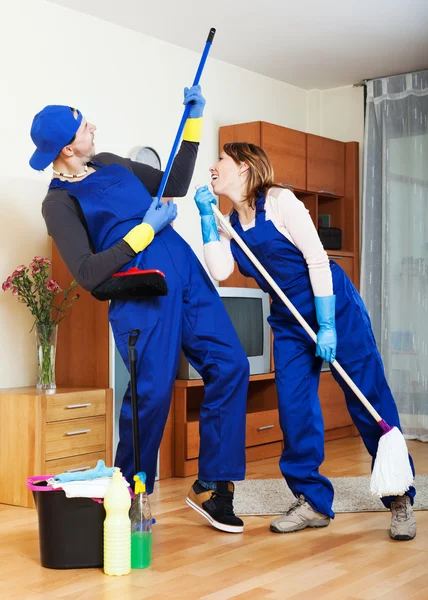 Housecleaners cleaning house