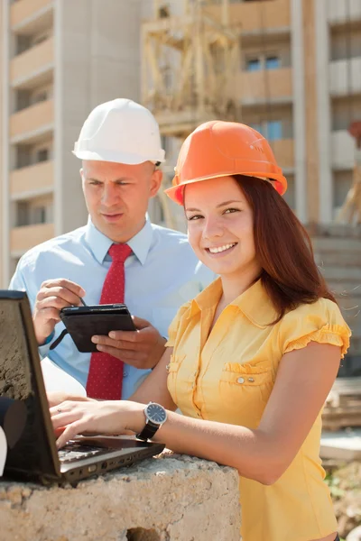 White-collar workers works on the building site