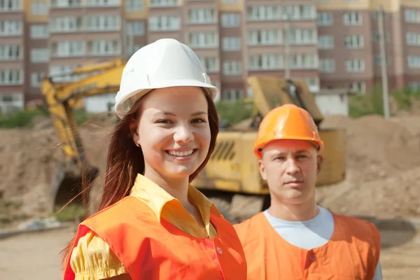 Portrait of two builders