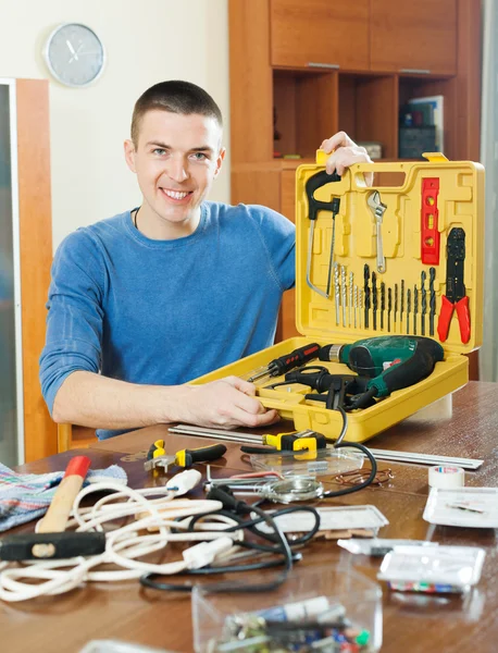 Happy man with set of working tools