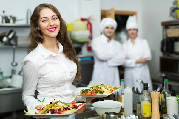 Chefs and young waiter